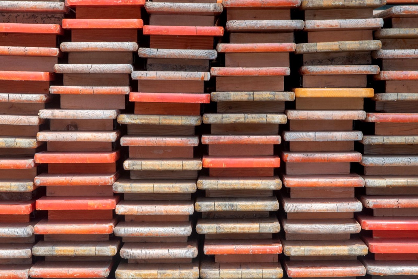 Stacked timber planks seen end-on