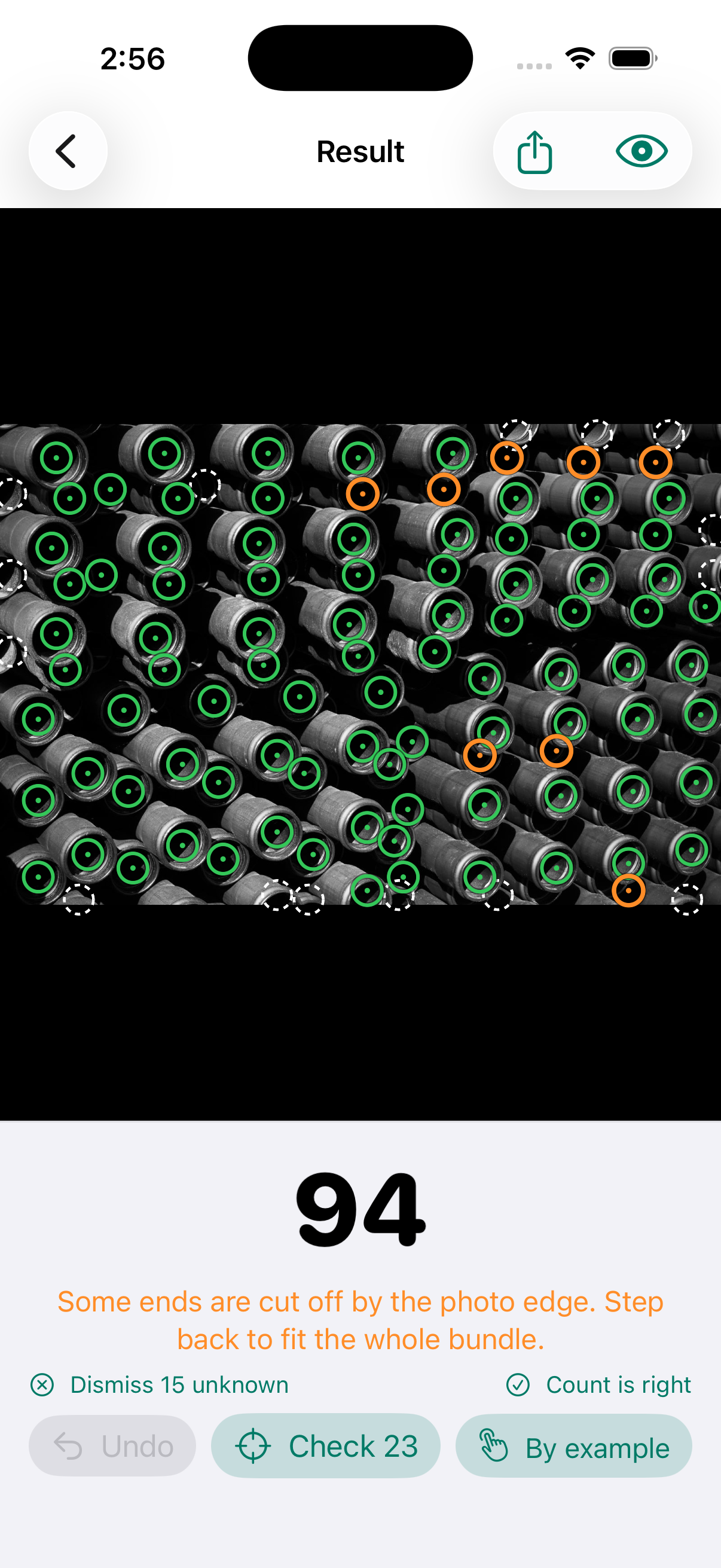 Counting Master result screen: a bundle of pipe ends, a ring on every end, the count 132 in large type, and the message Tap a ring to remove it, tap a missed item to add it.